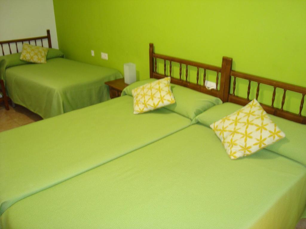 Posteľ alebo postele v izbe v ubytovaní Hostal Durán