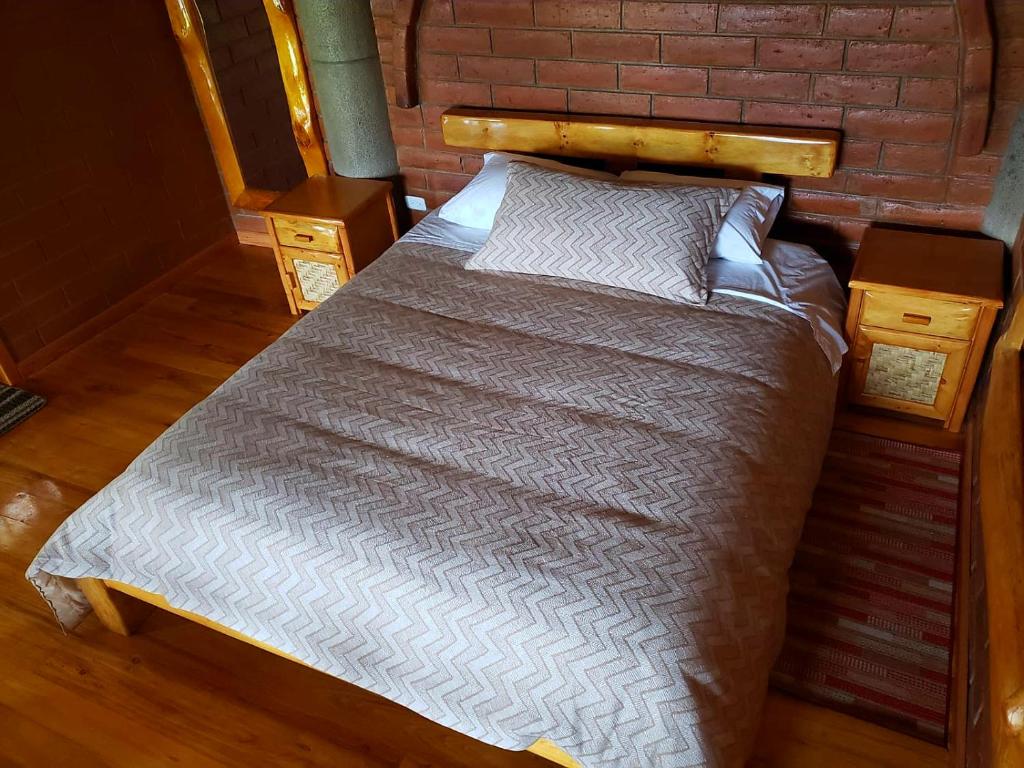Postel nebo postele na pokoji v ubytování ATALLARO Hospedaje