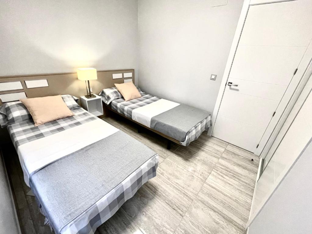 Postel nebo postele na pokoji v ubytování Exclusive Apartments on the first line of Benidorm Sol y Mar
