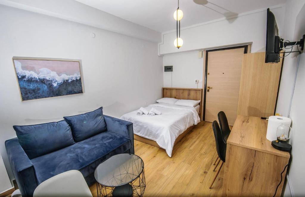 a living room with a couch and a bed at Dreamy Apartment City Center 7 thesbnbgr in Thessaloniki