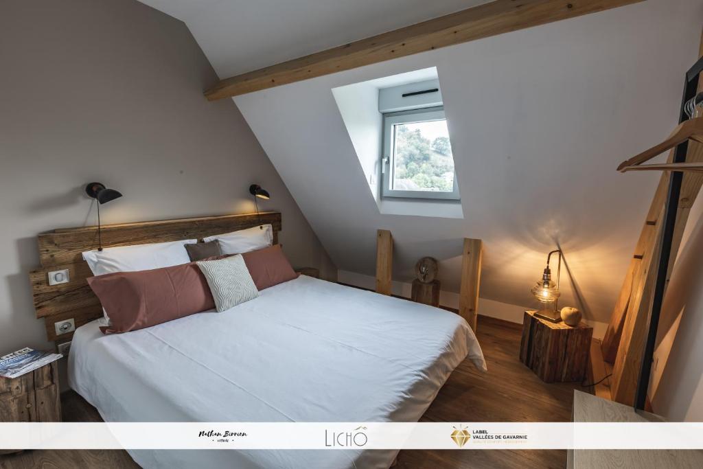 Postel nebo postele na pokoji v ubytování Grange Cornemusé au cœur des Pyrénées