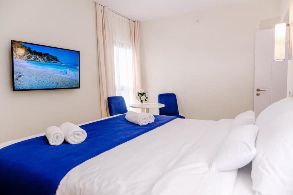 Postel nebo postele na pokoji v ubytování G-Point City Beach