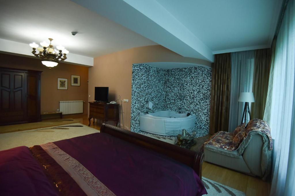 Postel nebo postele na pokoji v ubytování Hotel Gold