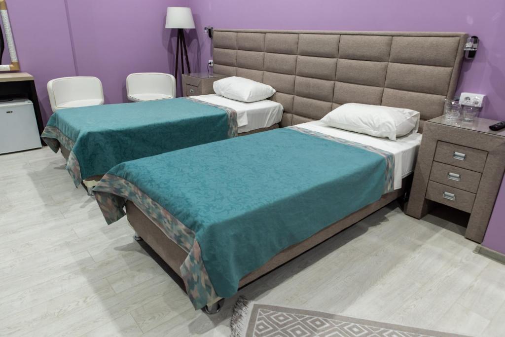 Postel nebo postele na pokoji v ubytování Hotel Gold