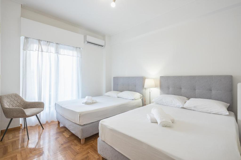 Postel nebo postele na pokoji v ubytování Athens Dreams & Suites Apartments