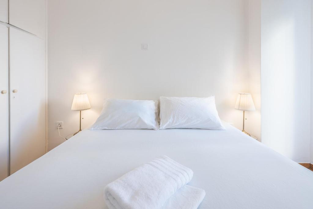 Postel nebo postele na pokoji v ubytování Athens Dreams & Suites Apartments