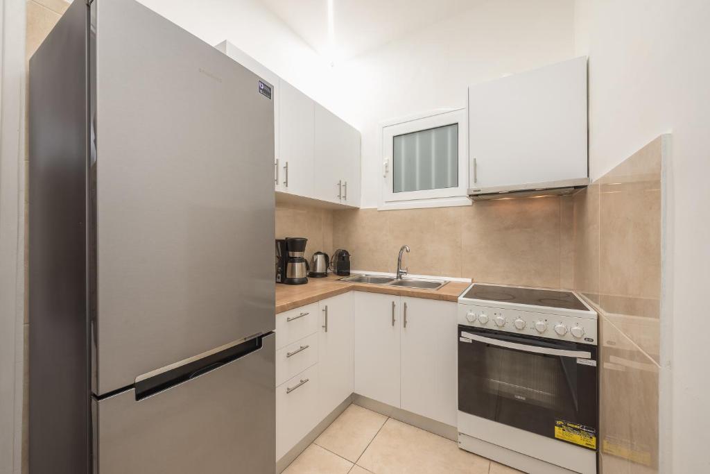 Kuchyň nebo kuchyňský kout v ubytování Athens Dreams & Suites Apartments