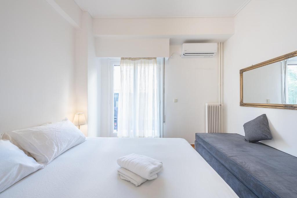 Postel nebo postele na pokoji v ubytování Athens Dreams & Suites Apartments