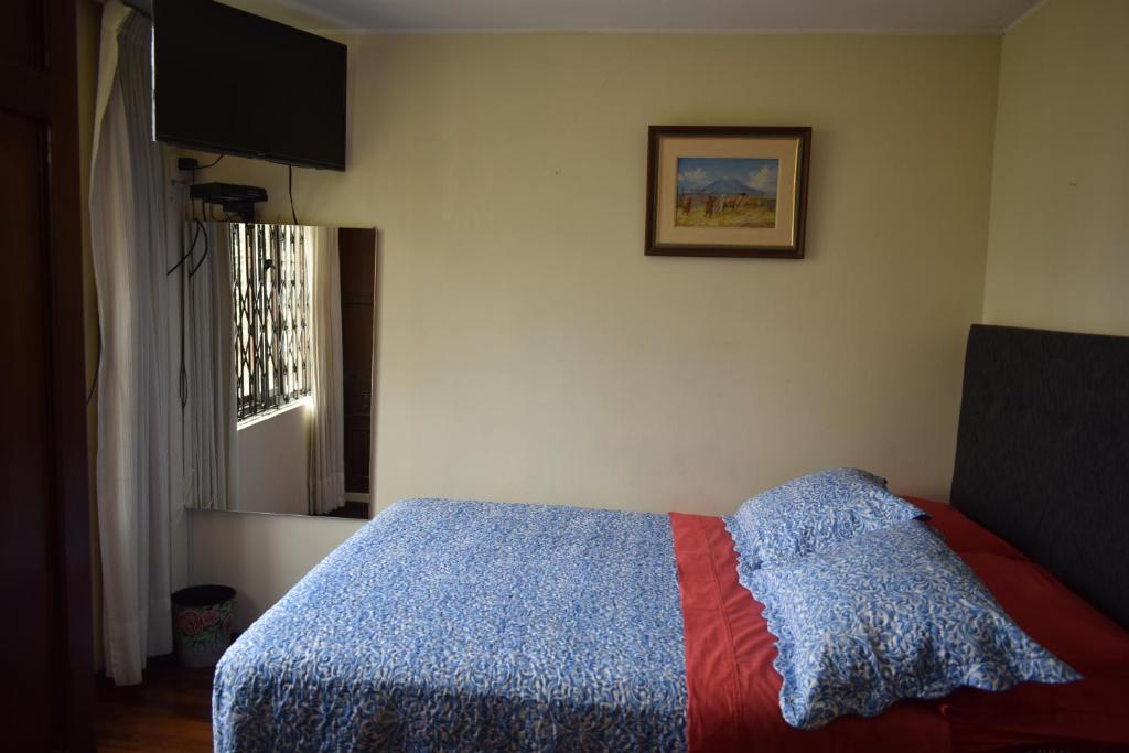 Postel nebo postele na pokoji v ubytování Hostal Donde Alberto