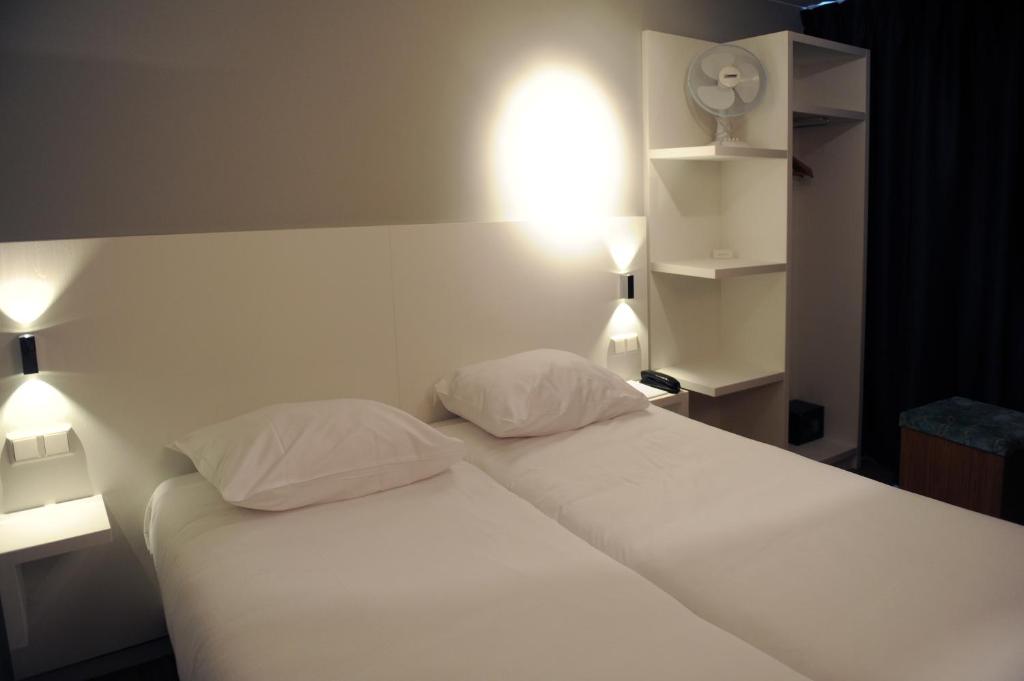 Postel nebo postele na pokoji v ubytování Hotel Andante aan Zee