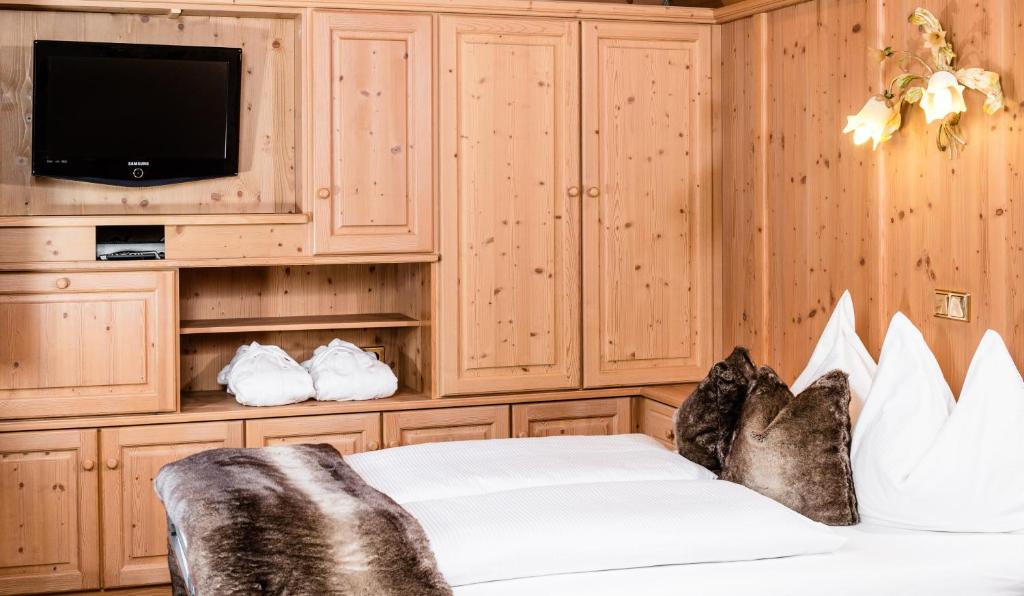 Postel nebo postele na pokoji v ubytování Suites Hotel Garden