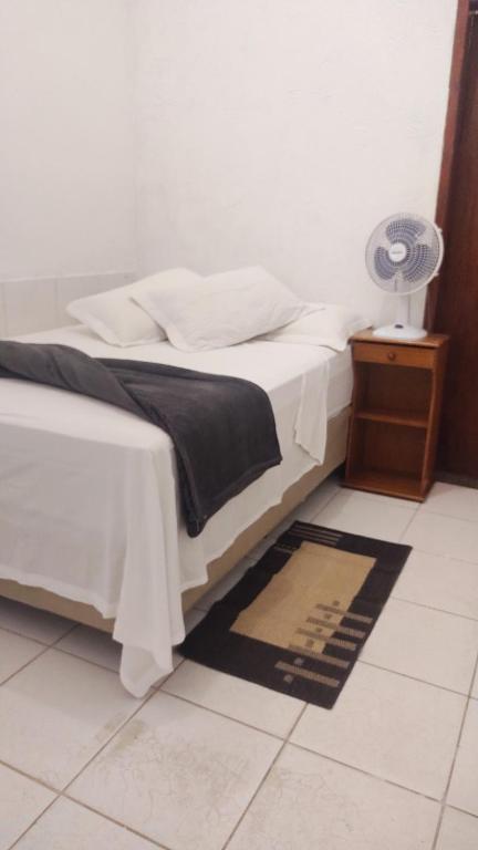 Cama ou camas em um quarto em Pousada Aquarela