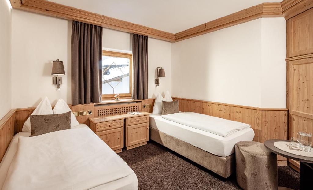 Postel nebo postele na pokoji v ubytování Suites Hotel Garden