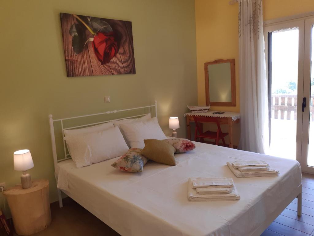 A bed or beds in a room at Andri House