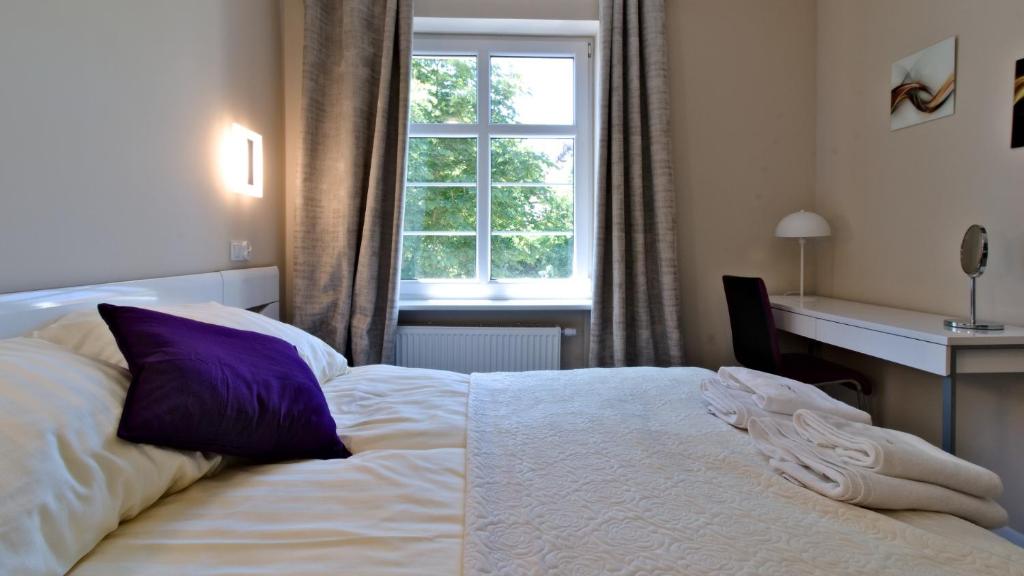 Ένα ή περισσότερα κρεβάτια σε δωμάτιο στο LC pokoje & apartamenty Z57