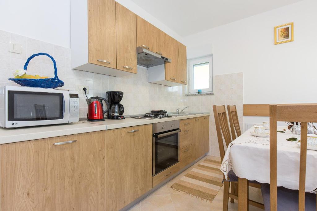 Kuchyň nebo kuchyňský kout v ubytování Apartman Andrea