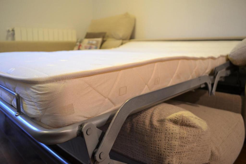 Postel nebo postele na pokoji v ubytování Apartament acollidor amb una gran llar de foc by RURAL D'ÀNEU