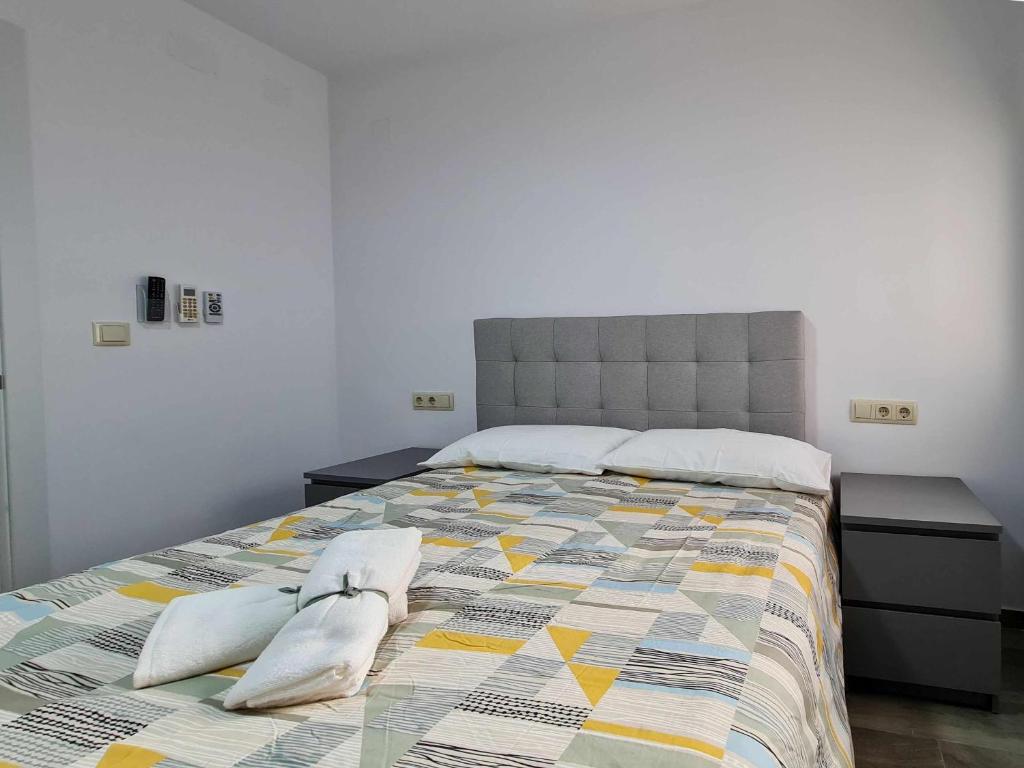 Tempat tidur dalam kamar di Villa Playa y Centro Exclusive Accommodation