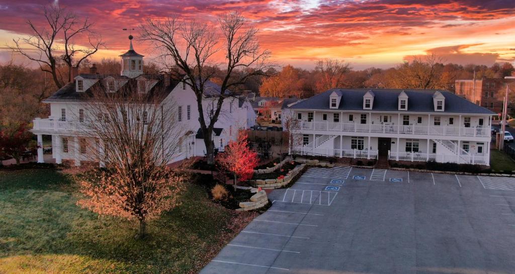 an aerial view of a large white building with a sunset at Inn at Elijah McLean's in Washington
