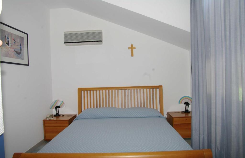 A bed or beds in a room at Residence Fontana Barone