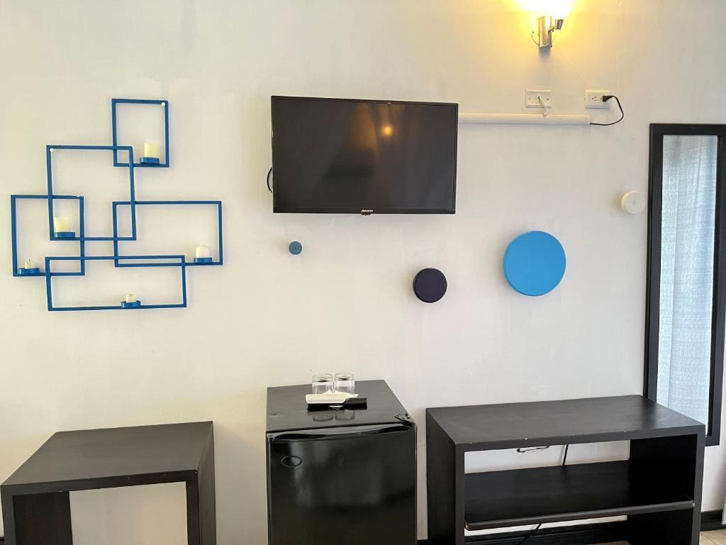 TV a/nebo společenská místnost v ubytování Palmazul Hotel & Spa