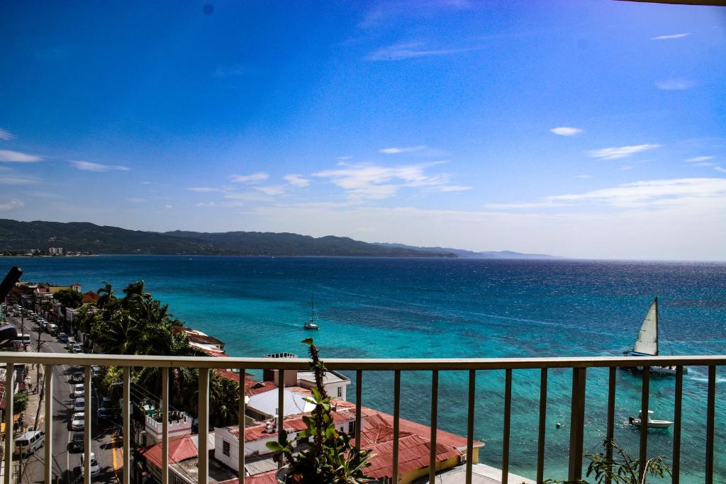 a view of the ocean from a balcony at Montego Bay Club Beach Resort in Montego Bay