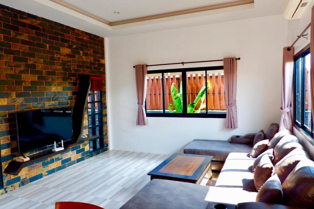 Posezení v ubytování Baan Noppadol Hua Hin Loft