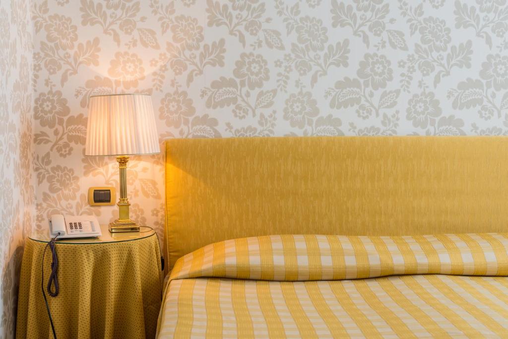 Postel nebo postele na pokoji v ubytování Albergo Alla Posta