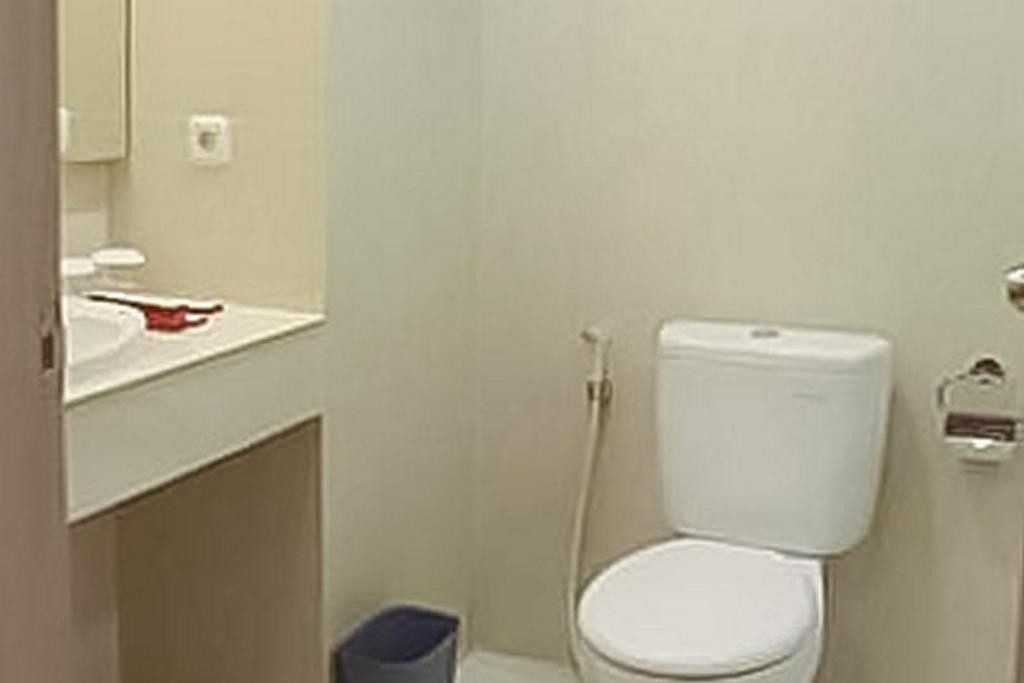 Koupelna v ubytování Hotel Mutiara Padang Sidimpuan Mitra RedDoorz