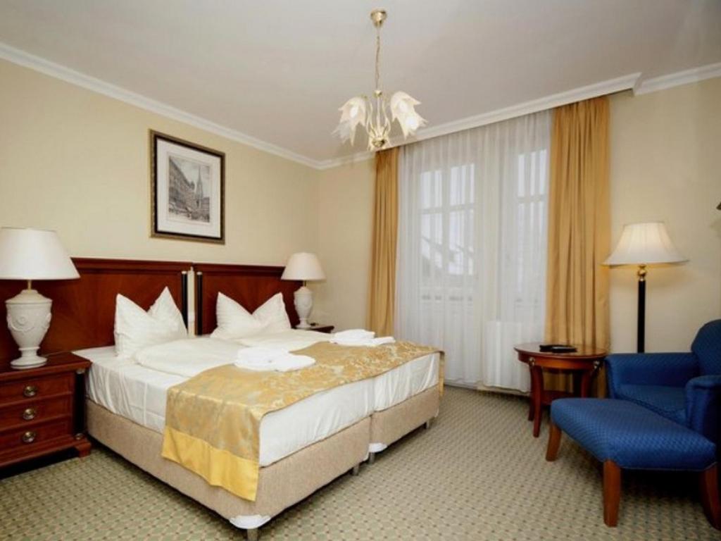 Postel nebo postele na pokoji v ubytování Hotel Villa Huber