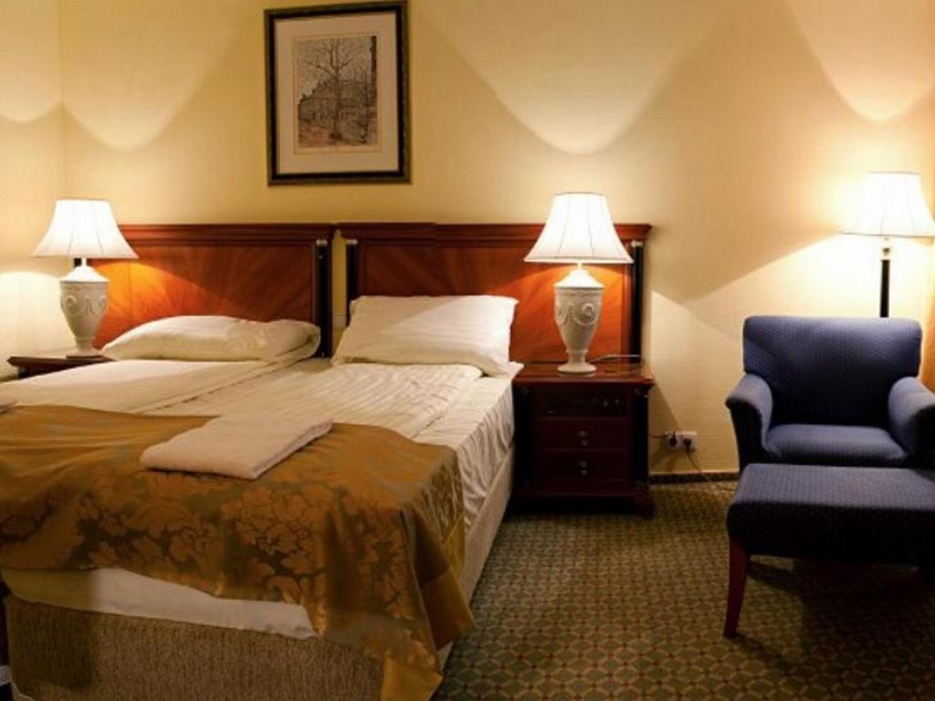 Postel nebo postele na pokoji v ubytování Hotel Villa Huber