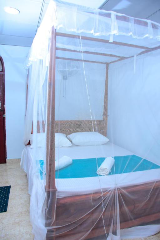 Postel nebo postele na pokoji v ubytování Relax Guest House Dambulla