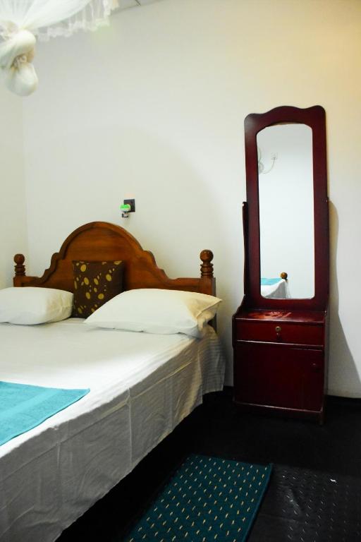 Postel nebo postele na pokoji v ubytování Relax Guest House Dambulla