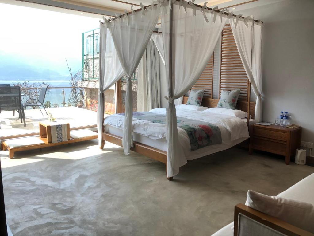 Postel nebo postele na pokoji v ubytování Dali Dare Sea View Gueshouse