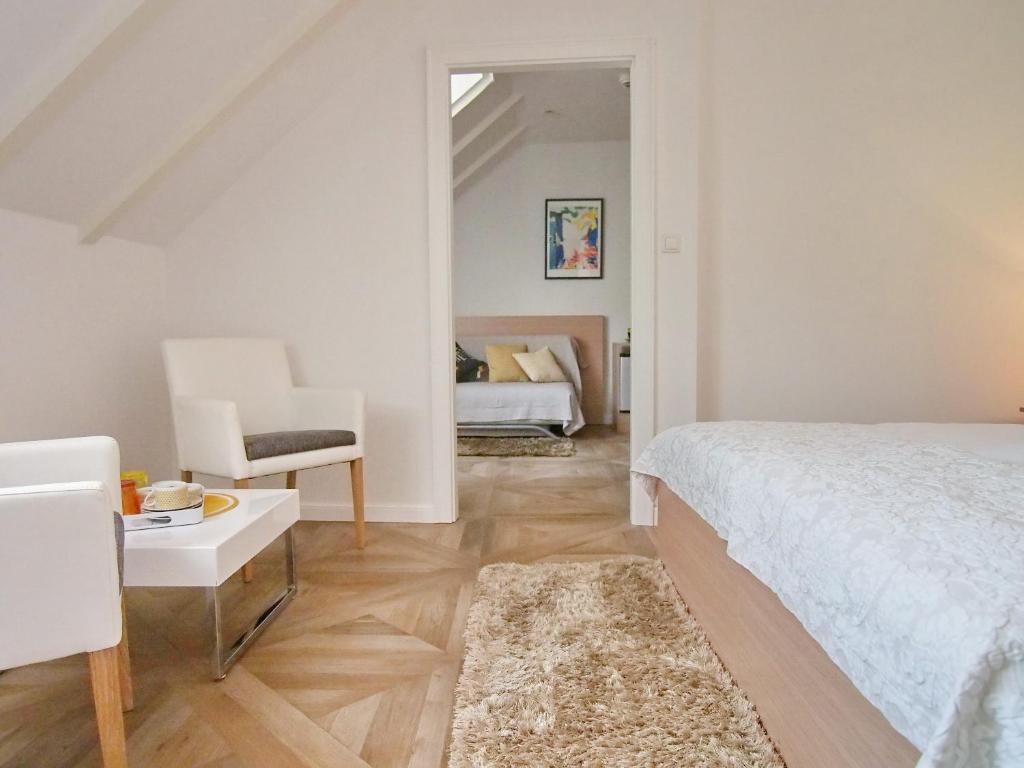 Postel nebo postele na pokoji v ubytování Apartment & Rooms Ivušić