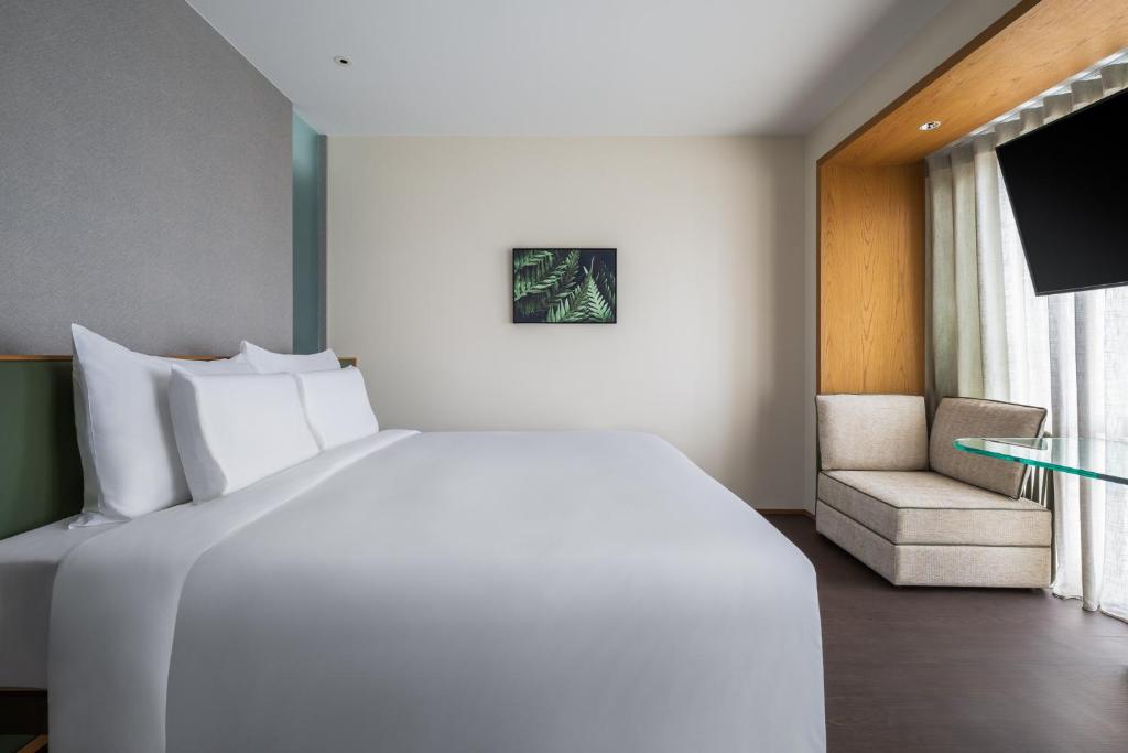 Postel nebo postele na pokoji v ubytování Humble Boutique Hotel