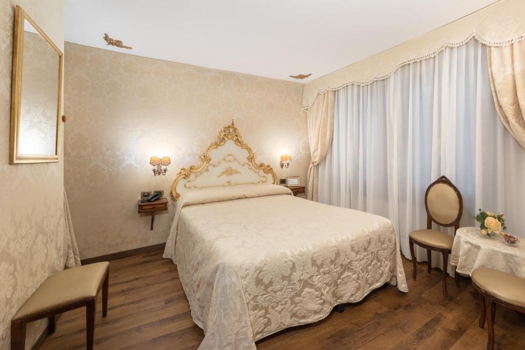 Postel nebo postele na pokoji v ubytování Residenza La Loggia