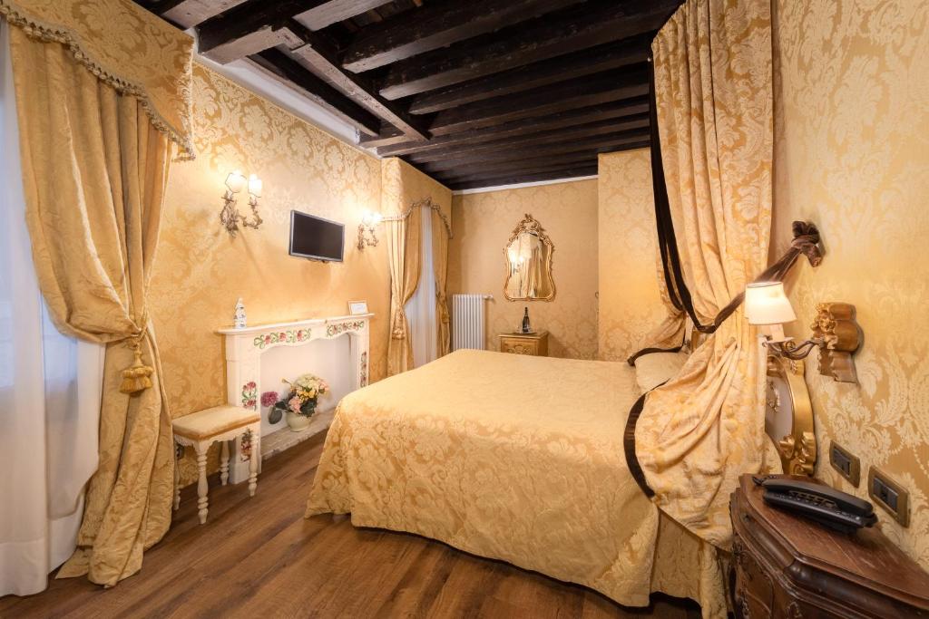 Postel nebo postele na pokoji v ubytování Residenza La Loggia