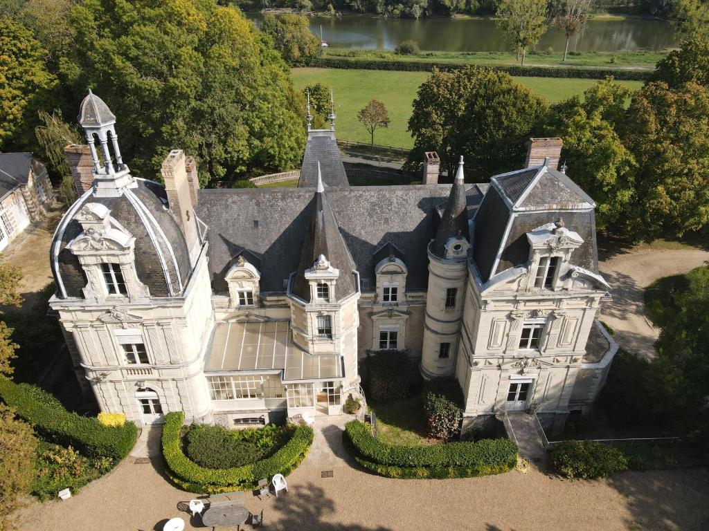 an aerial view of an estate with a large house at Château le Fresne in Bouchemaine