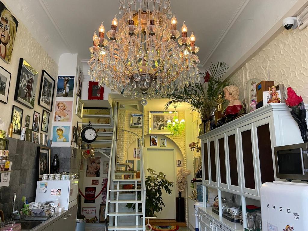 a chandelier is hanging in a room with a store at Hotel Urban Dreams in Antwerp