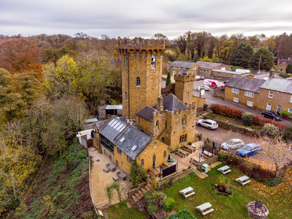 an aerial view of an old castle in a town at Castle At Edgehill in Banbury