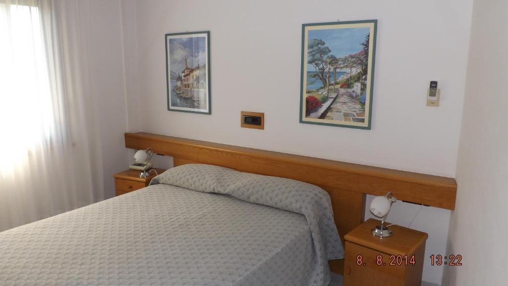 Postel nebo postele na pokoji v ubytování Hotel Le Palme