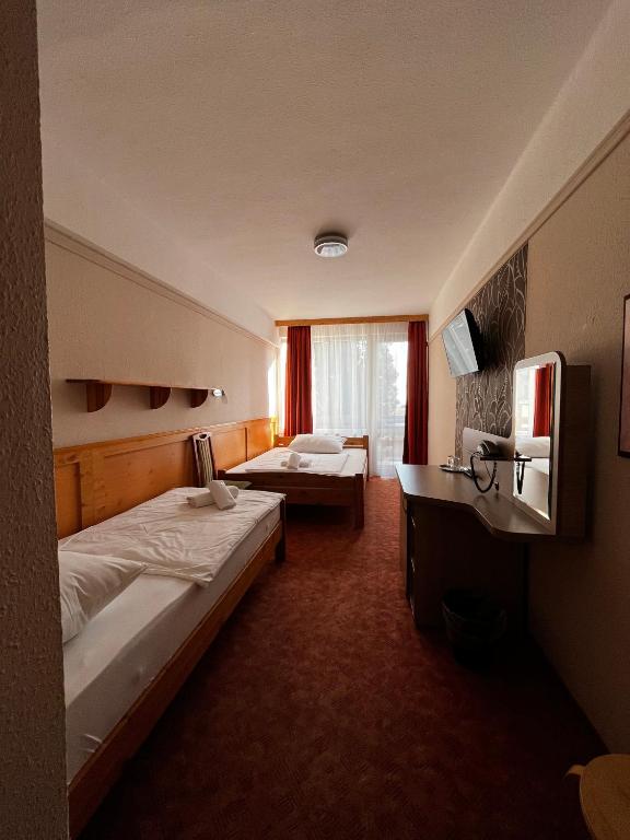 Postel nebo postele na pokoji v ubytování Nereus Park Hotel