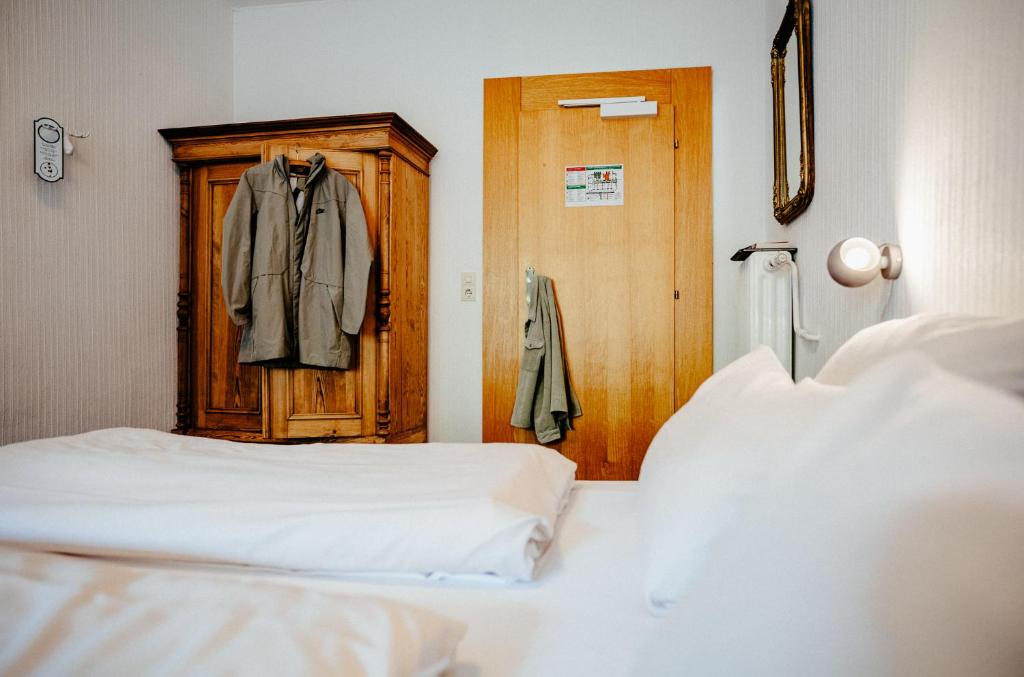 Postel nebo postele na pokoji v ubytování Alpenrose Bayrischzell Hotel