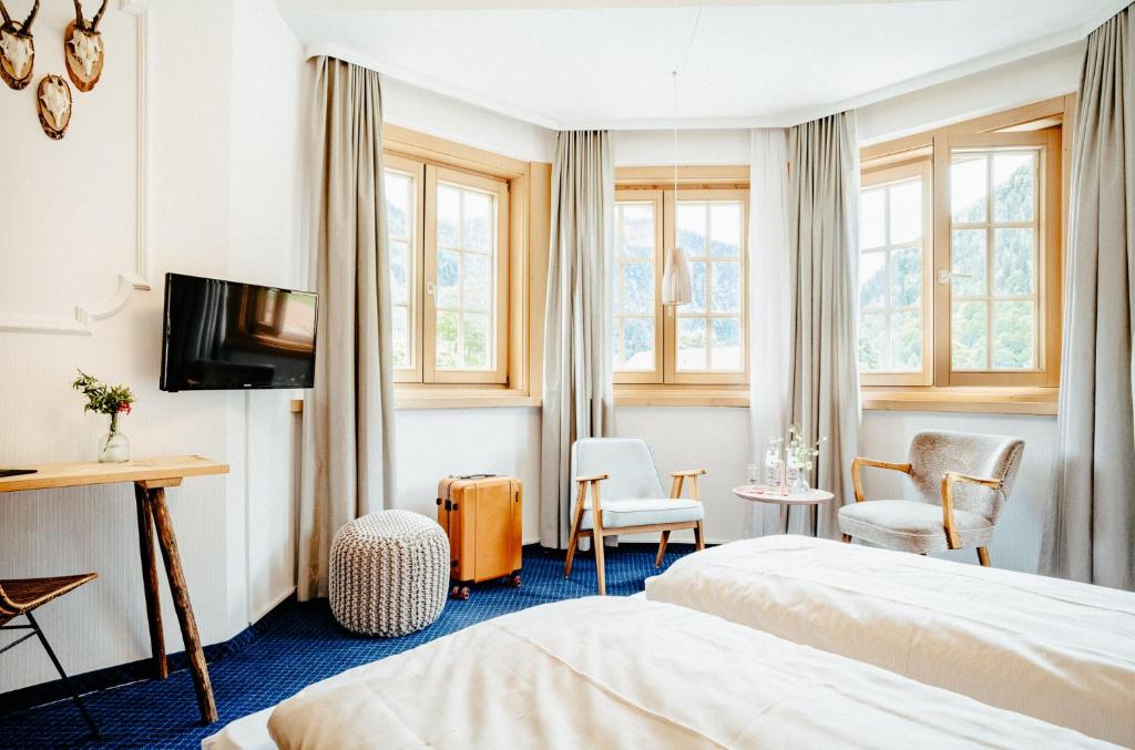 TV a/nebo společenská místnost v ubytování Alpenrose Bayrischzell Hotel