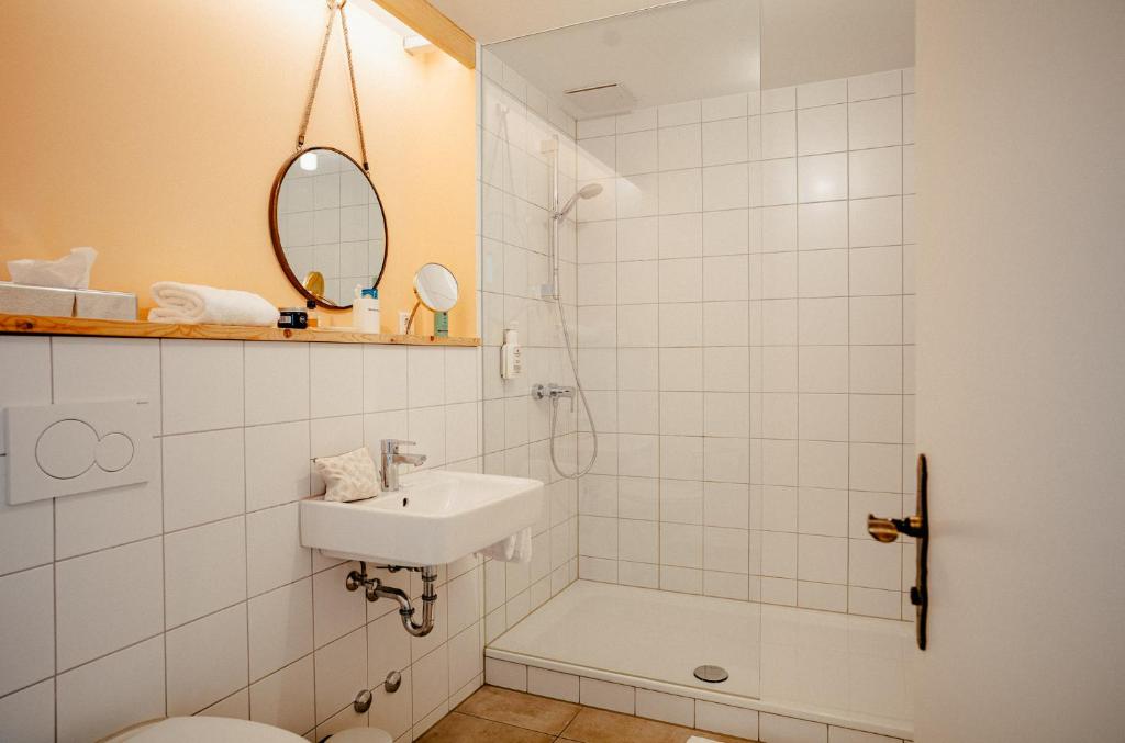 Koupelna v ubytování Alpenrose Bayrischzell Hotel