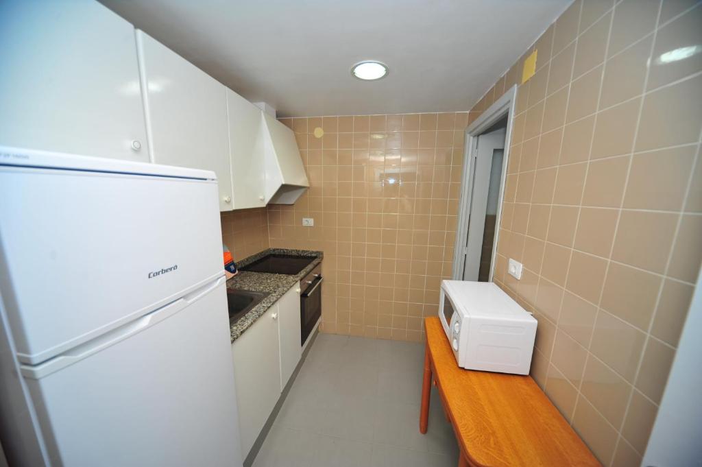 Kuchyň nebo kuchyňský kout v ubytování Apartamento Princicasim 1 dormitorio