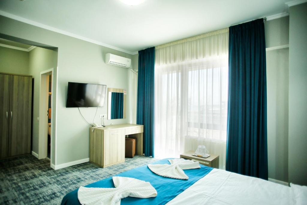 TV a/nebo společenská místnost v ubytování Hotel Agapi Mamaia