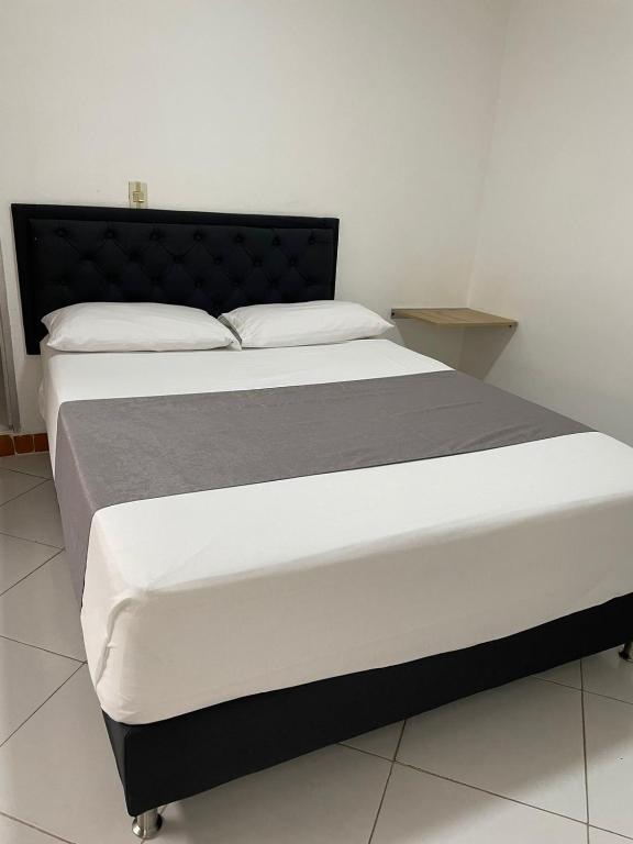 Postel nebo postele na pokoji v ubytování Hotel Picasso 70