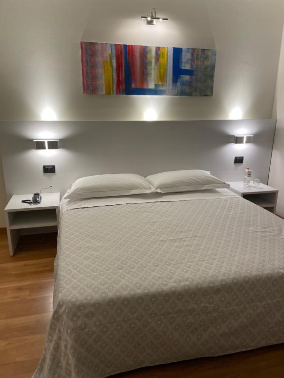 Postel nebo postele na pokoji v ubytování Albergo Ligabue